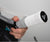 Close up image of someone putting new grip on a JOOLA Pickleball paddle handle.